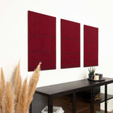 Hochwertiges 3D Wandbild in der Farbe rot und schwarz aus Filz und Holz, hängend im Wohnzimmer