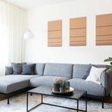 Hochwertiges 3D Wandbild in der Farbe beige und schwarz aus Filz und Holz, hängend im Wohnzimmer